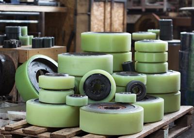 Piles of various sizes of polyurethane wheels.