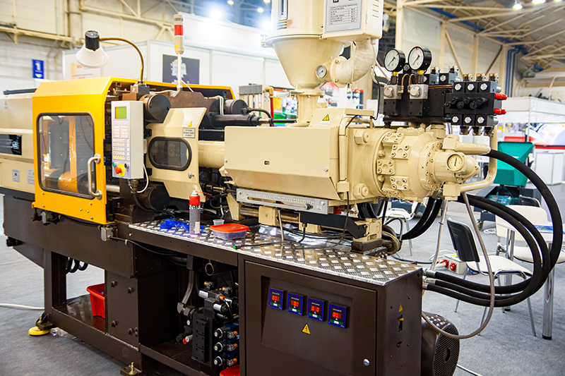 An industrial plastic injection machine.